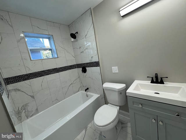 full bathroom featuring tiled shower / bath, vanity, and toilet