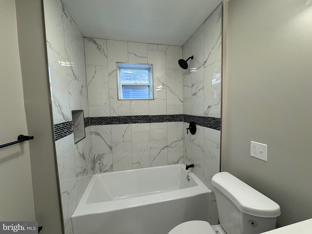 bathroom with toilet and tiled shower / bath combo