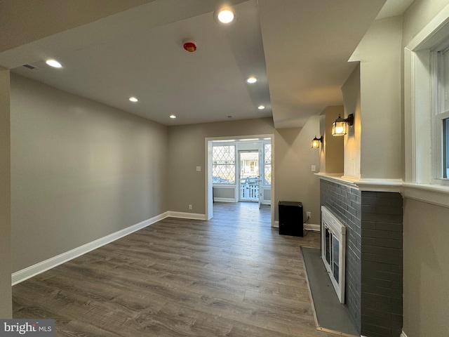 unfurnished living room featuring dark hardwood / wood-style flooring