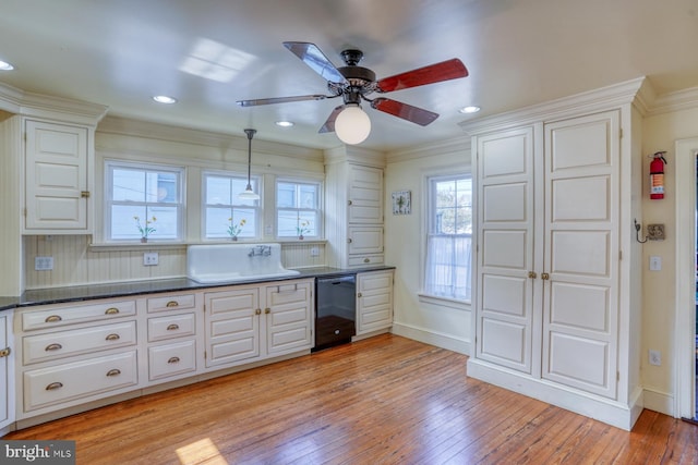 kitchen featuring light hardwood / wood-style floors, dishwasher, ceiling fan, and ornamental molding