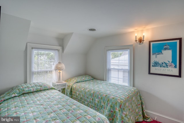 bedroom featuring lofted ceiling