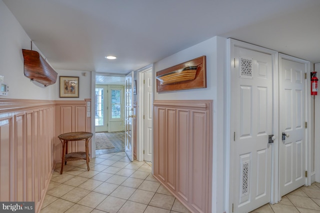 hallway featuring light tile patterned floors