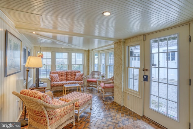 sunroom / solarium with lofted ceiling