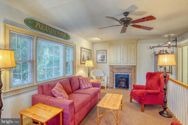 living room featuring ceiling fan and carpet flooring