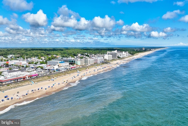 bird's eye view featuring a view of the beach and a water view