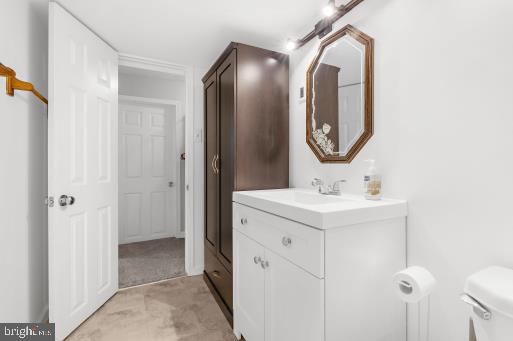 bathroom with vanity and toilet