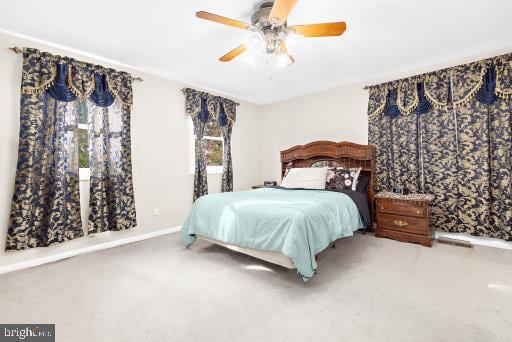 carpeted bedroom with ceiling fan