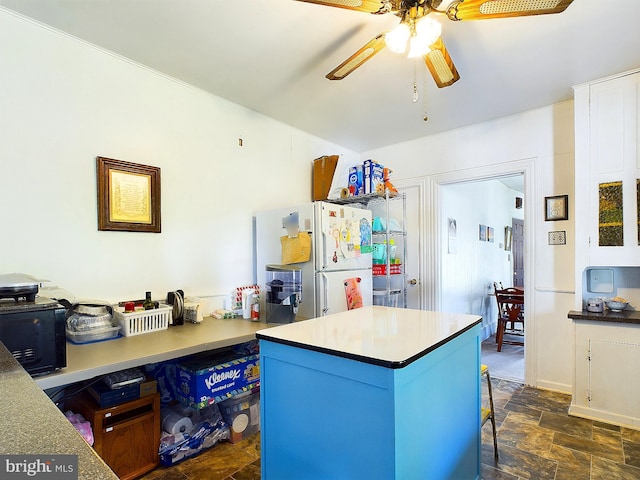 kitchen featuring ceiling fan and white refrigerator