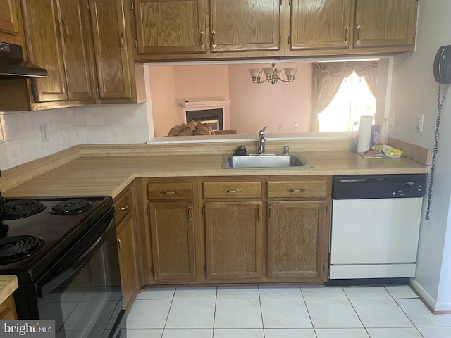 kitchen with tasteful backsplash, sink, dishwasher, black / electric stove, and light tile patterned floors