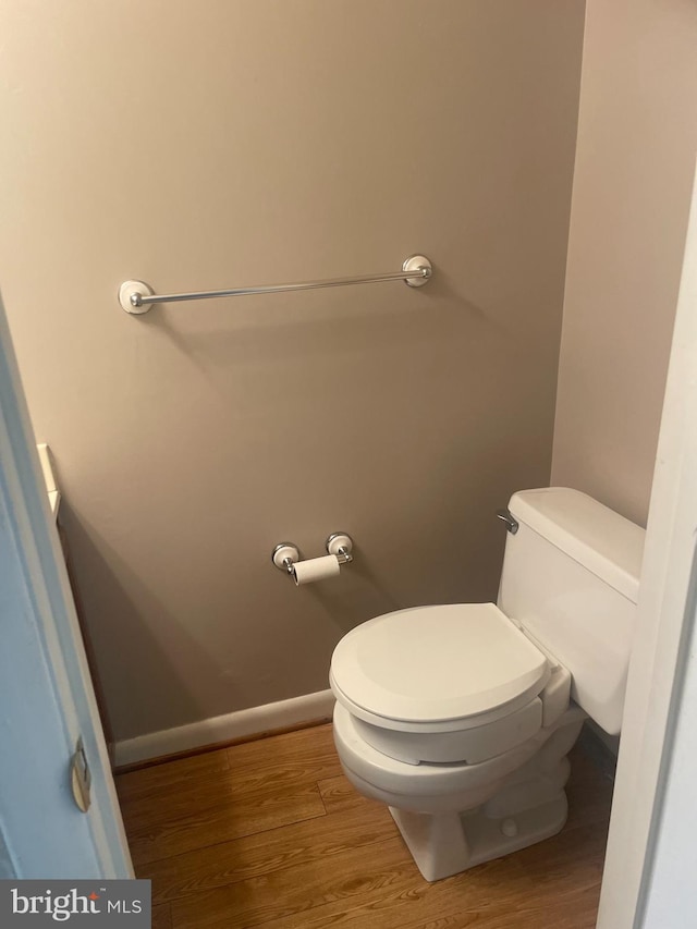 bathroom featuring toilet and hardwood / wood-style floors