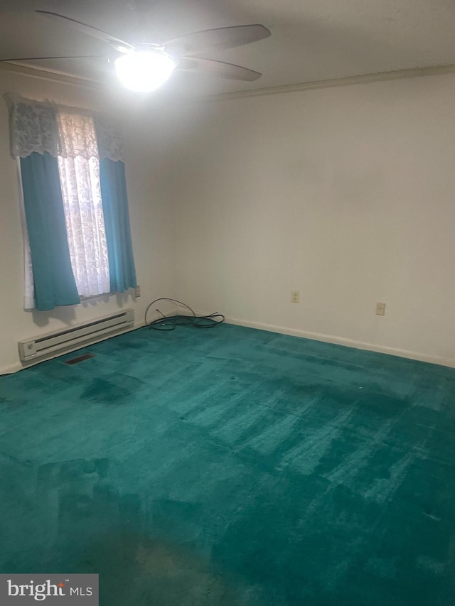 unfurnished room featuring a baseboard heating unit, carpet floors, and ceiling fan