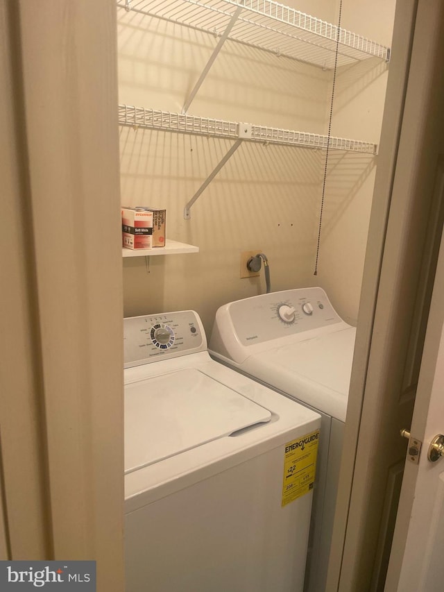 washroom featuring independent washer and dryer