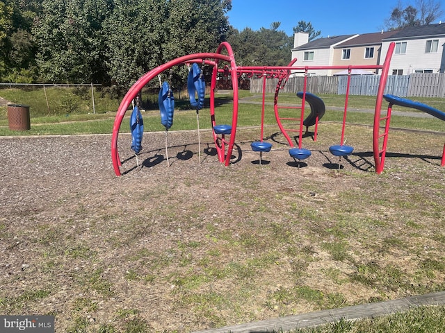 view of jungle gym featuring a lawn