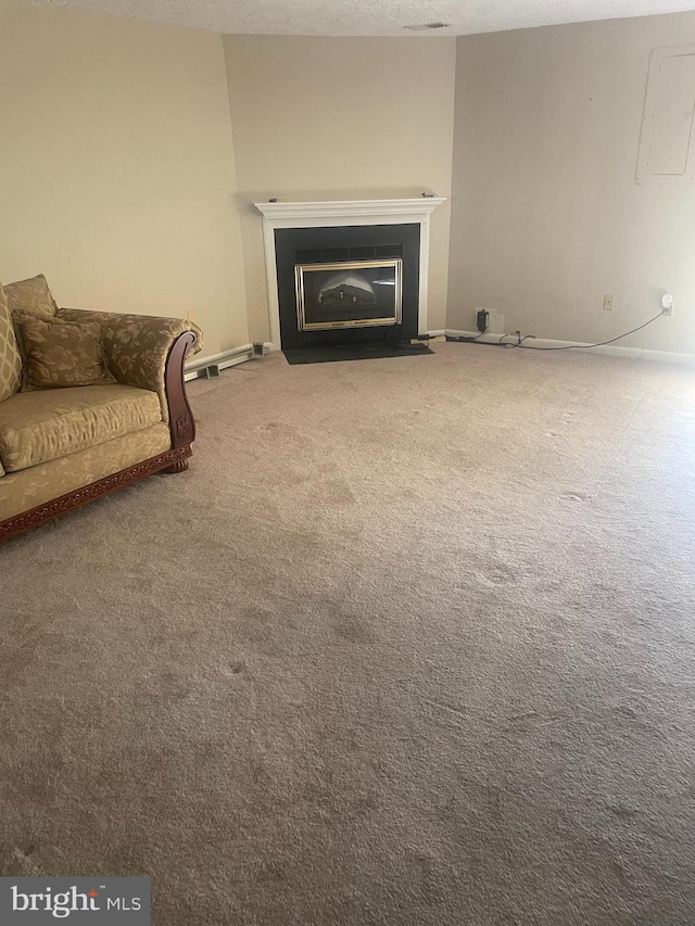 unfurnished living room with carpet floors and a textured ceiling