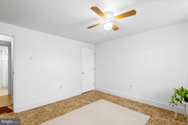 spare room with ceiling fan