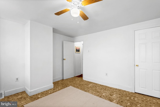 unfurnished bedroom featuring ceiling fan