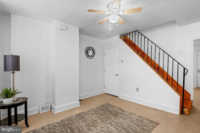 foyer featuring ceiling fan