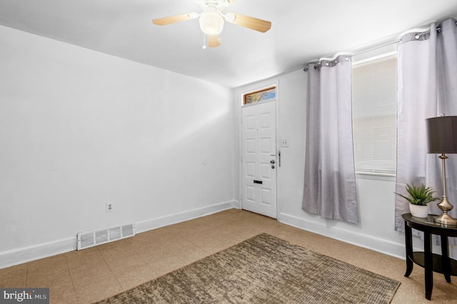 entrance foyer featuring ceiling fan