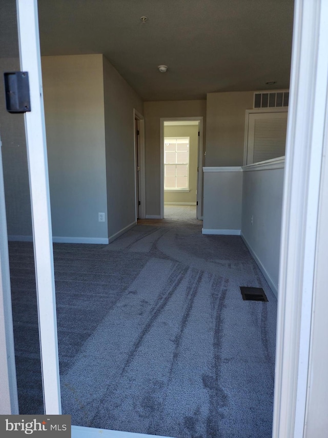 unfurnished room featuring carpet floors