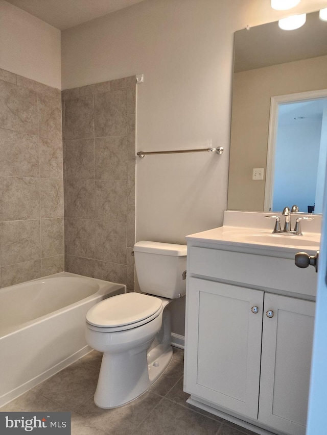 bathroom featuring vanity, toilet, and tile patterned floors