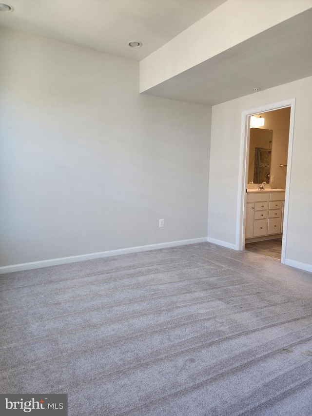 spare room with light colored carpet