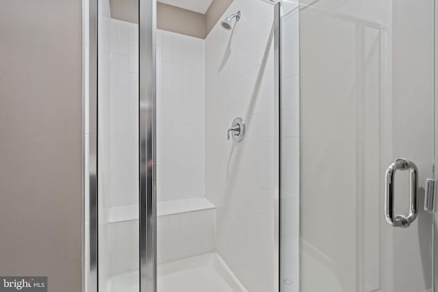 bathroom featuring an enclosed shower