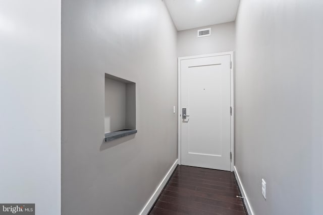 doorway to outside featuring dark hardwood / wood-style flooring