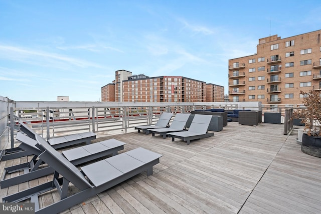 wooden terrace with an outdoor hangout area