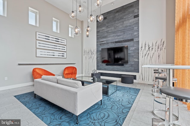 living room featuring a towering ceiling