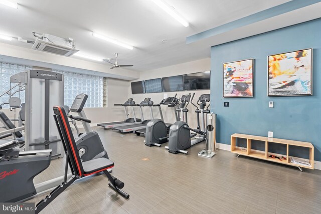 workout area with ceiling fan and plenty of natural light