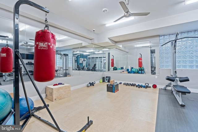 exercise room with ceiling fan