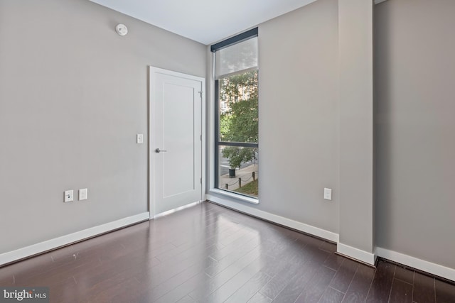 empty room featuring dark hardwood / wood-style floors