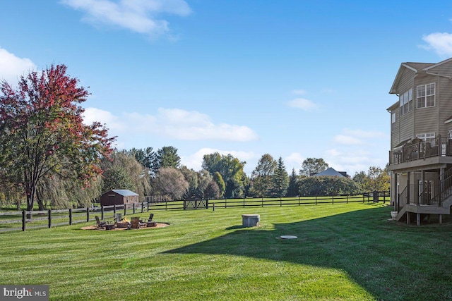 view of yard with an outdoor structure and fence