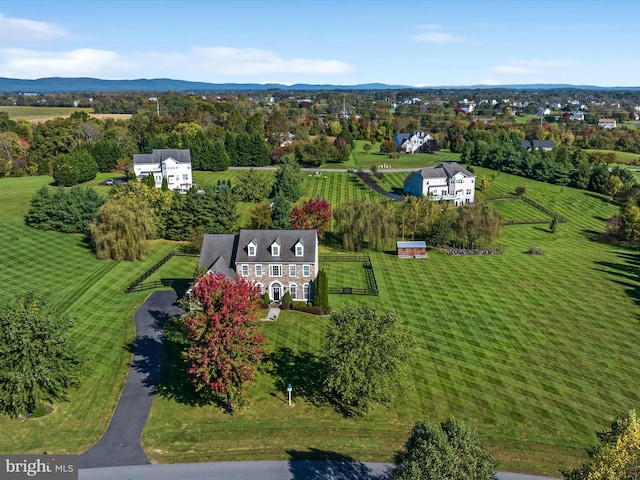 aerial view with a mountain view and a rural view