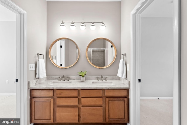 bathroom with a sink and double vanity