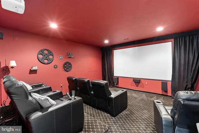 home theater room featuring recessed lighting, dark carpet, and visible vents