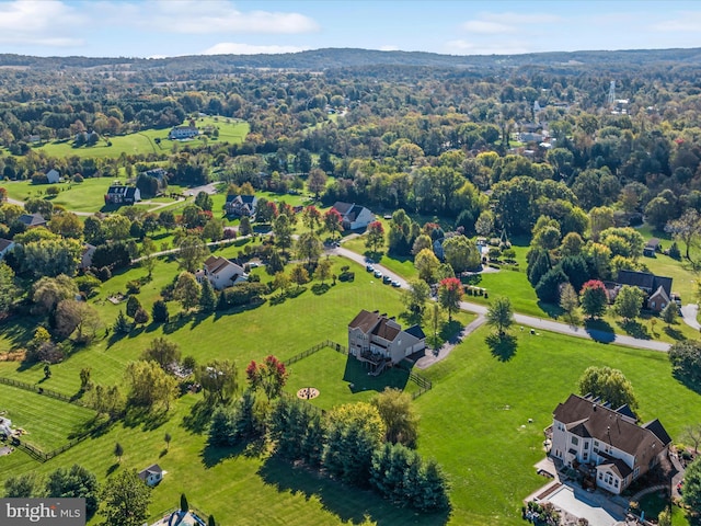 birds eye view of property with a rural view