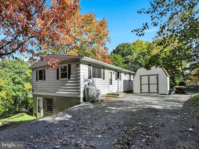 view of front of house with a storage shed