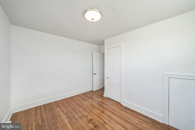 spare room featuring light hardwood / wood-style floors