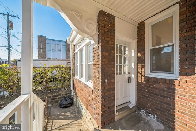 entrance to property featuring covered porch