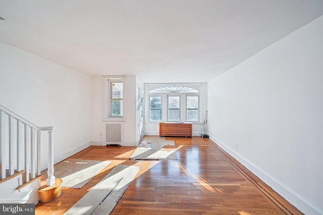 interior space featuring radiator and light hardwood / wood-style floors