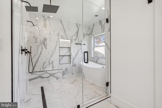 4609 Willow Run Dr, Annandale, VA 22003 - bathroom featuring marble tiled floors, a marble finish shower, and a freestanding bath