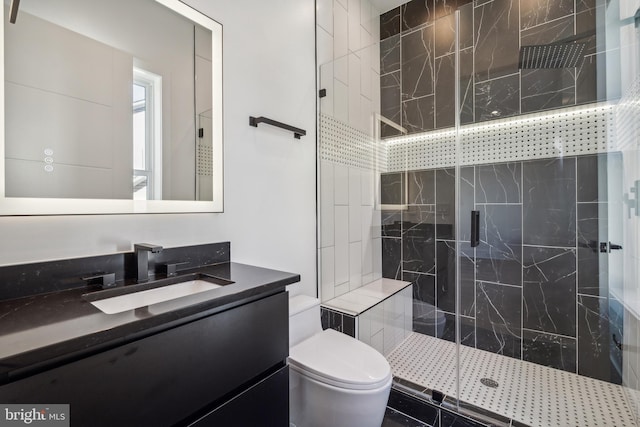 bathroom featuring vanity, toilet, and walk in shower