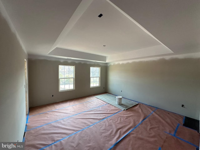 empty room featuring a tray ceiling