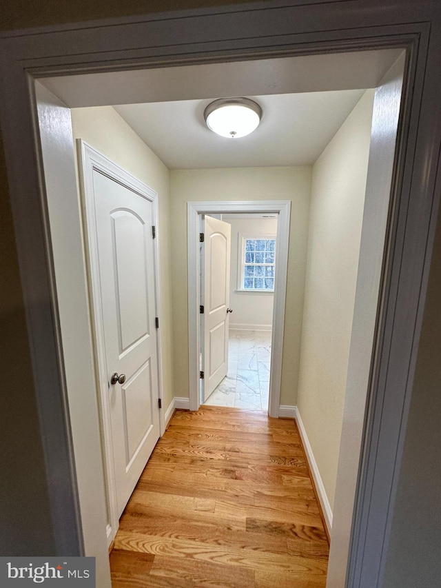 hallway featuring light wood-type flooring