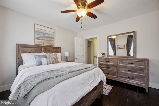 bedroom with ceiling fan and dark hardwood / wood-style floors