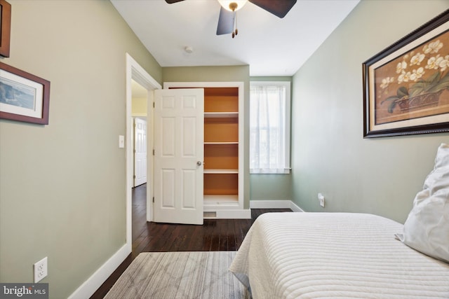 bedroom featuring a closet, ceiling fan, and dark hardwood / wood-style floors