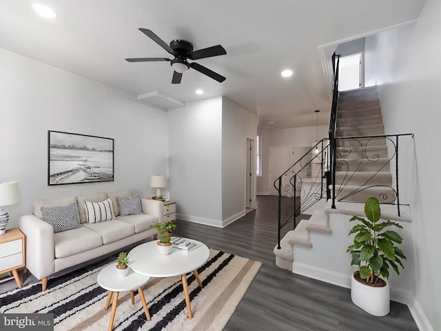 living room with dark hardwood / wood-style floors and ceiling fan