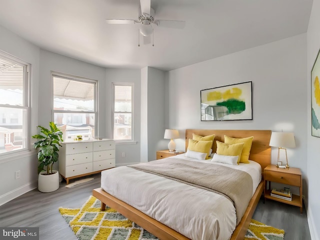 bedroom with hardwood / wood-style floors and ceiling fan