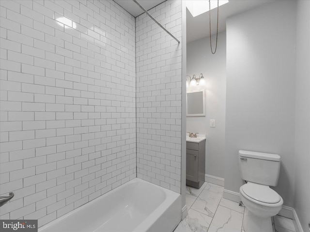 full bathroom with vanity, tiled shower / bath combo, and toilet